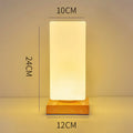 Nordic solid wood USB charging table lamp with touch dimming and flower-shaped white shade.