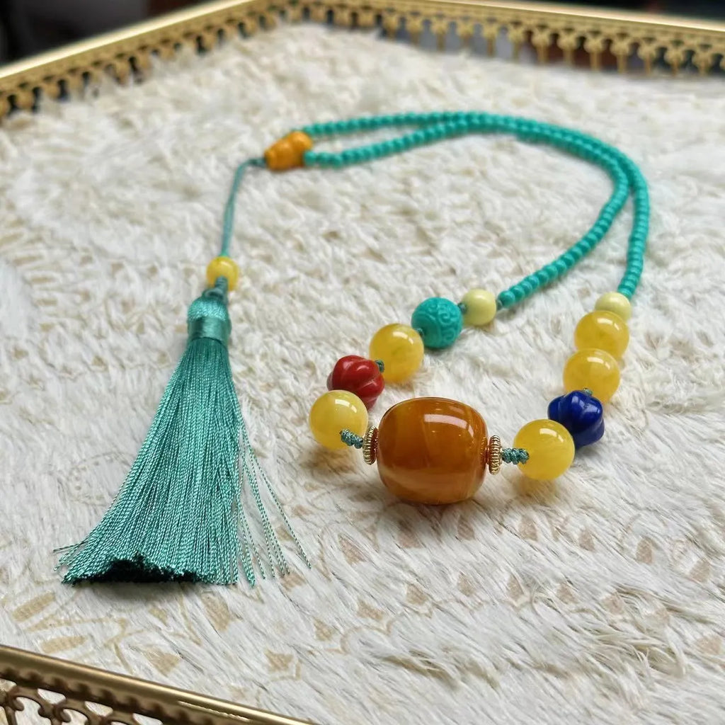 Turquoise clavicle necklace with hand-woven mesh flower pendant on ball bead chain, adjustable length
