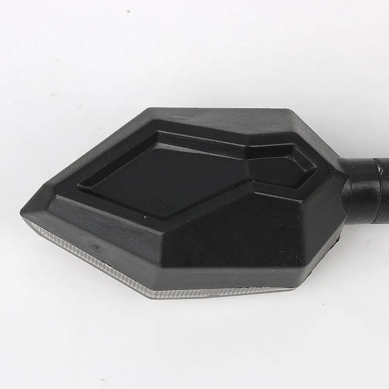 Arrow-shaped LED motorcycle turn signal indicator light with 12V connector.