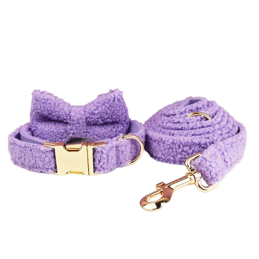 Purple cloth dog collar, leash, vest and bow four-piece pet accessory set showing coordinated design