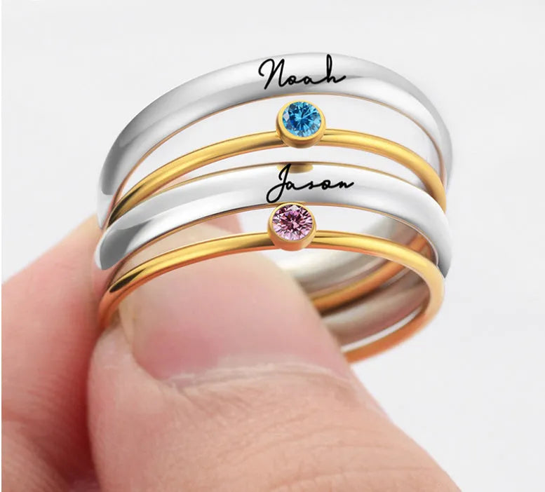 December colour birthstone engraved on a geometric titanium steel ring.