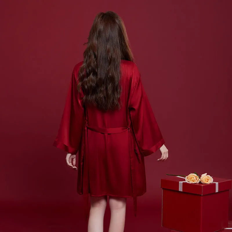 Red silk matching men's and women's pyjama set with long sleeves and trousers