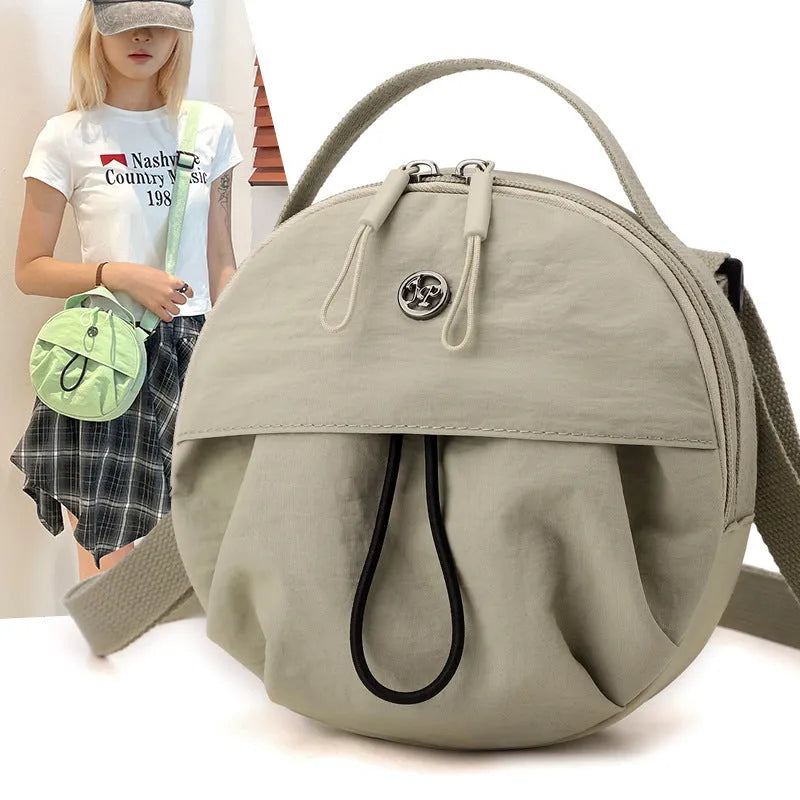Nylon crossbody messenger bag in urban style with internal organisers, shown in a selection of colours.