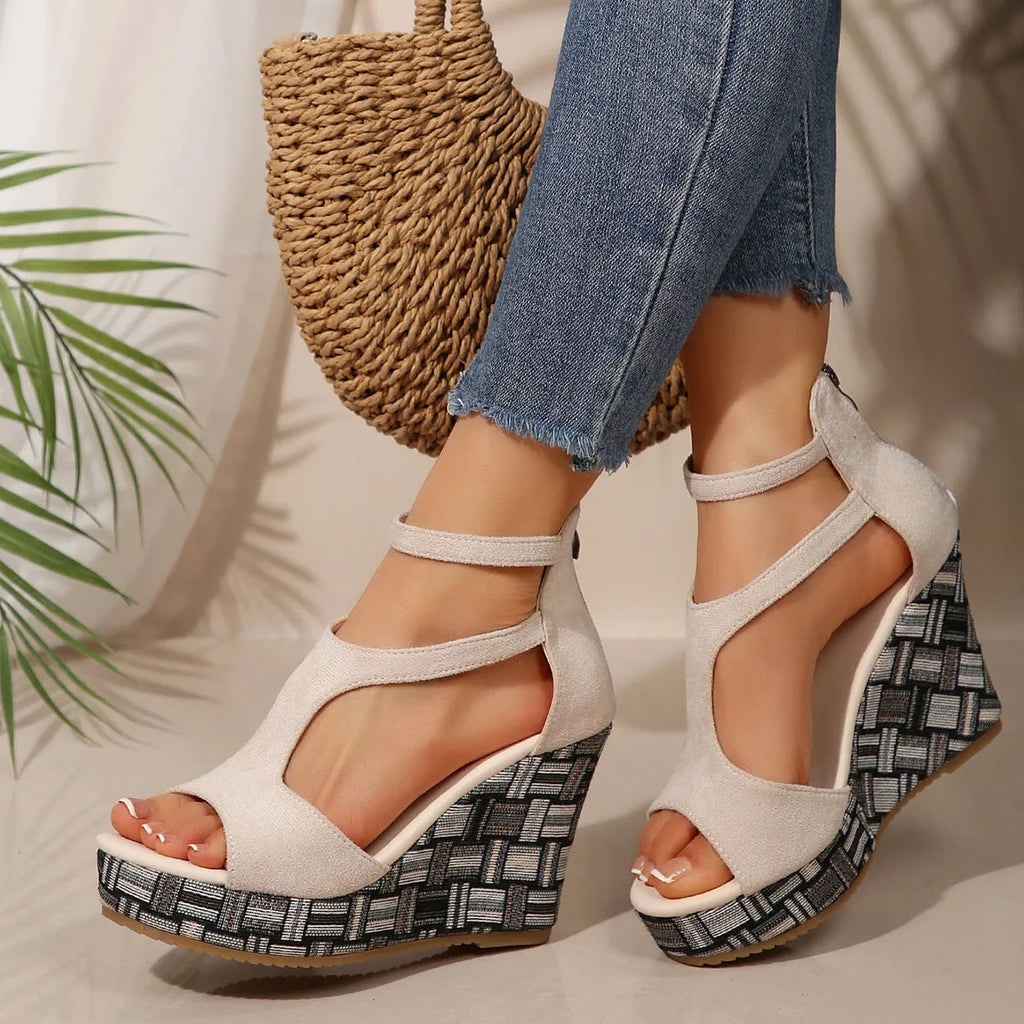 Women's cream white ankle-strap buckle sandals with thick rubber sole and cloth upper.