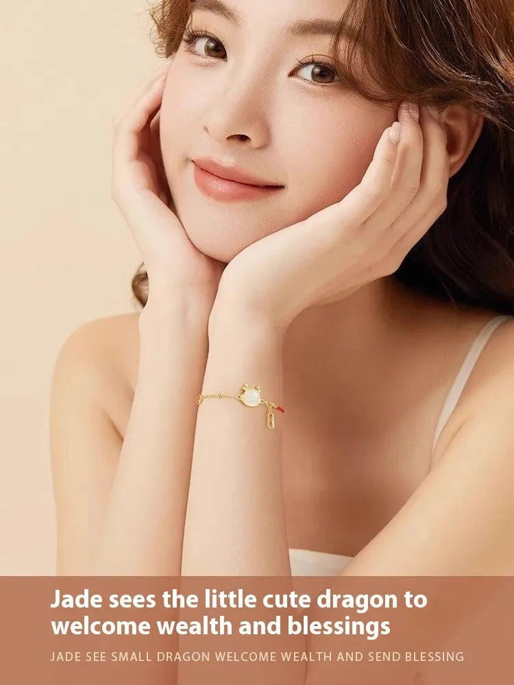 Women's silver-plated bracelet with Dragon zodiac motif and central Hetian jade stone.