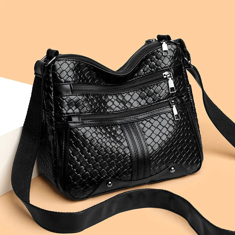 Woven single shoulder messenger bag in horizontal square shape with multiple compartments and PU leather construction