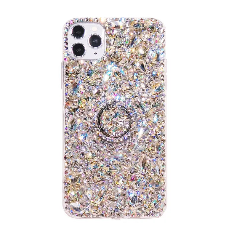Sparkling diamond acrylic phone case for Samsung Galaxy phone on a table.