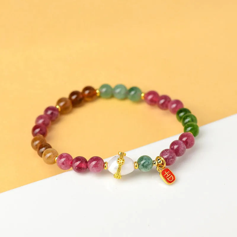 Geometric chalcedony bracelet with 6.5mm beads and natural crystal construction