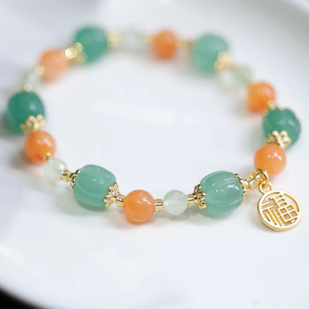 Duobao pumpkin bracelet for women with Jinsi Jade barrel beads and hanging charm on 14-16.5cm wrist