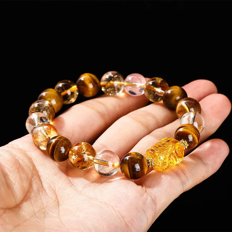 Yellow tiger's eye and citrine gemstone bracelet with 10mm round beads and a silver steel Pi Xiu charm.