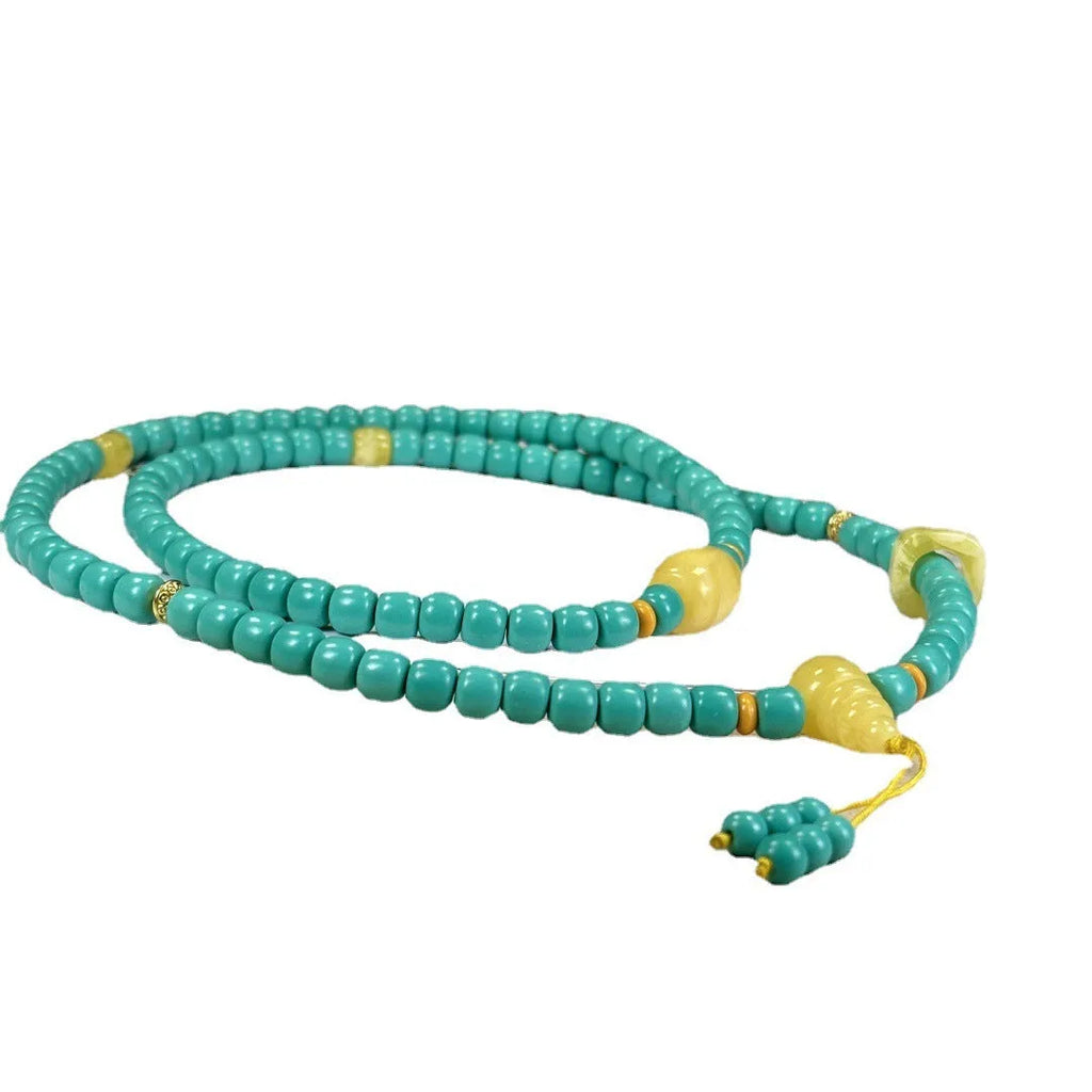 Turquoise clavicle necklace with hand-woven mesh flower pendant on ball bead chain, adjustable length