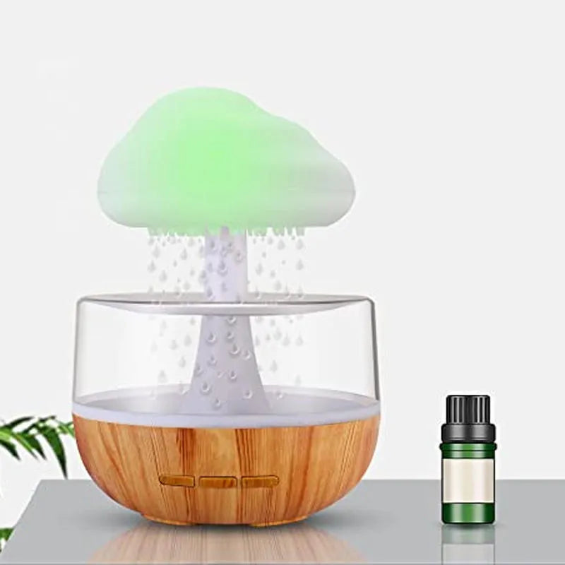 White raining cloud mushroom lamp humidifier and aromatherapy diffuser on a desk.