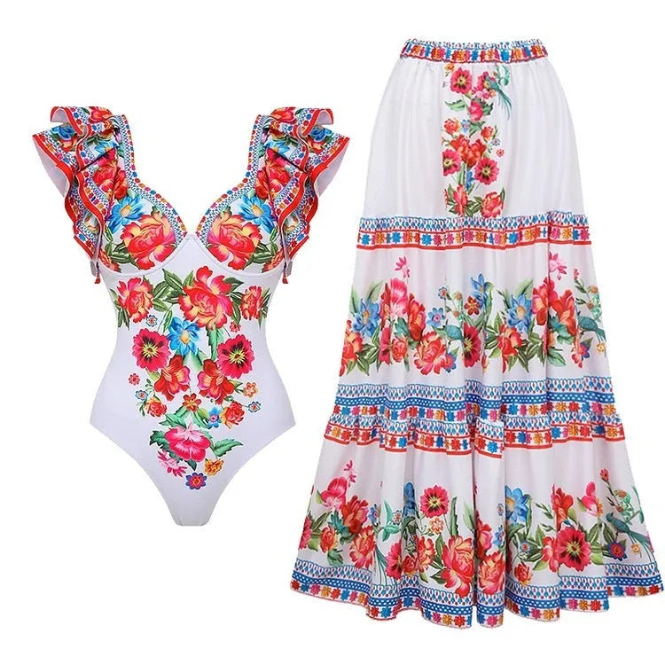 Women's printed polyester one-piece swimsuit on a hanger, showing rose pink, blue, white, and red colour options.