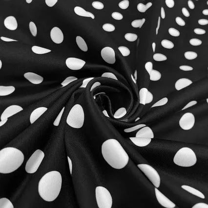 Women's multicolour polka dot pleated dress with a square collar, short sleeves, and a front zip fastener.