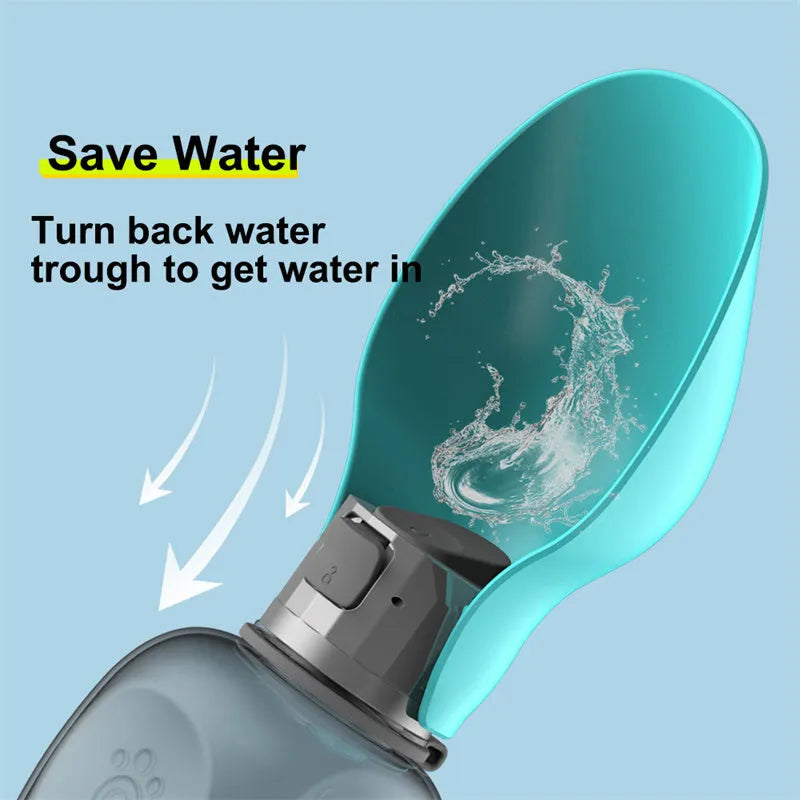 Blue-grey foldable dog water bottle with drinking trough open, showing wrist strap and lock key.