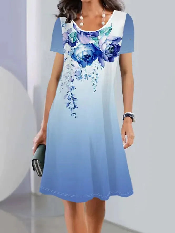 Women's light blue floral print A-line midi dress with short sleeves on a hanger.