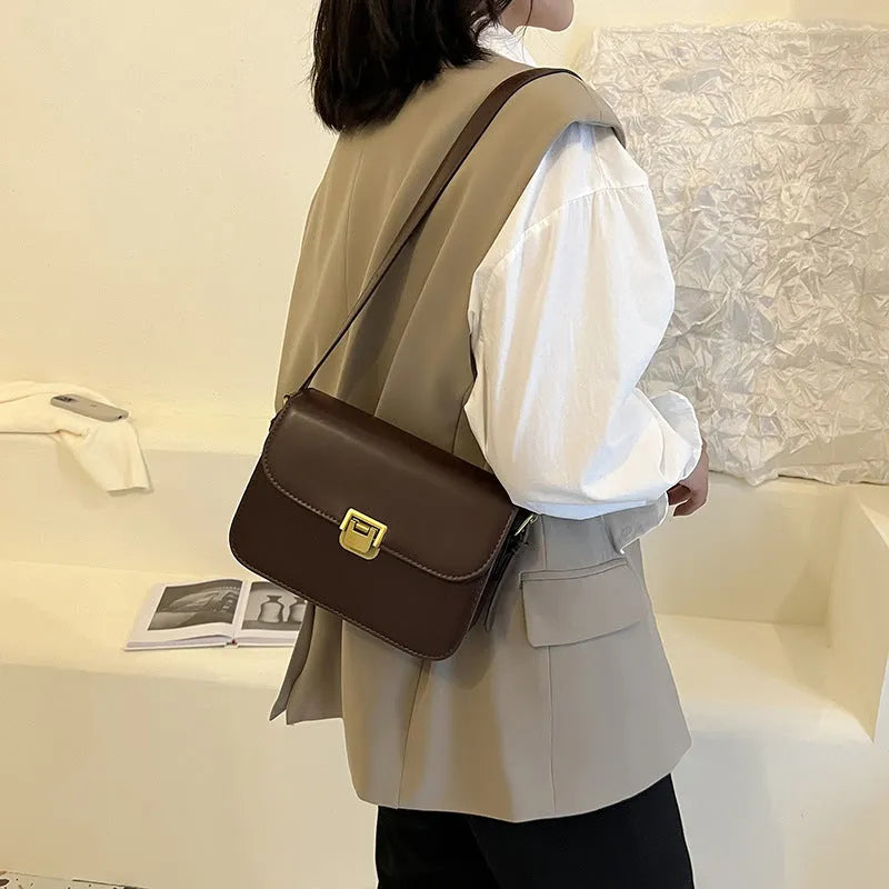 Soft PU leather women's small square shoulder bag in black with one-shoulder underarm carry design