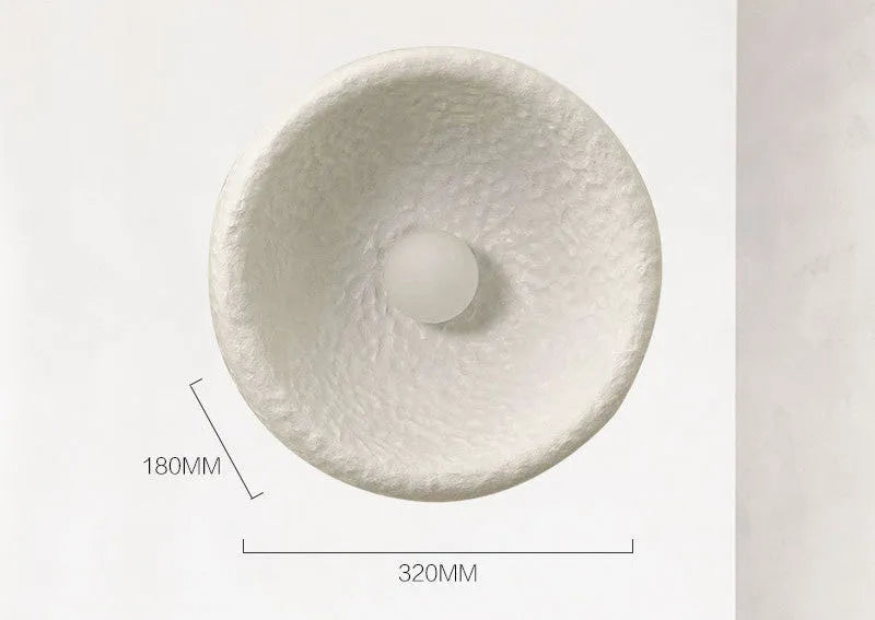 Japanese-style modern wall lamp with white resin shade in three size options.