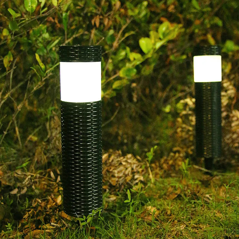 Outdoor garden light with abstract design and simulated flame effect for courtyard installation