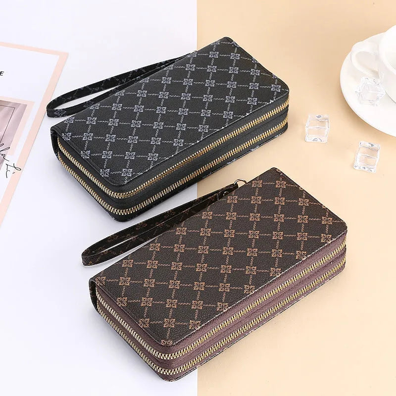 Long black PU leather wallet clutch with phone slot, card holders, and zippered coin purse