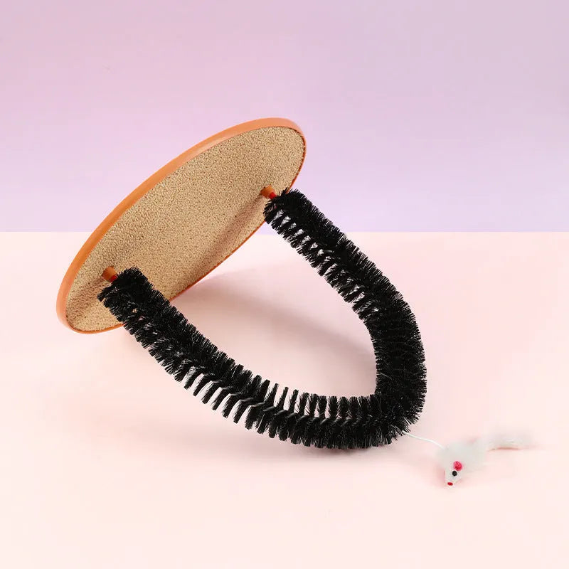 Black arch-shaped cat grooming brush with scratching surfaces and attached plush mouse toy on non-slip base
