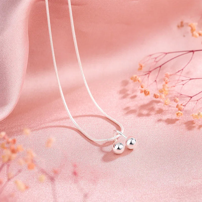 Silver cherry necklace on snake bone chain, adjustable length, Korean style jewellery for women.