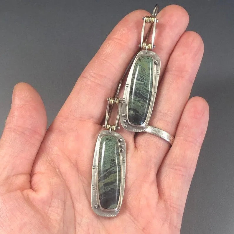 Geometric two-tone marble pattern alloy earrings with simple modern design