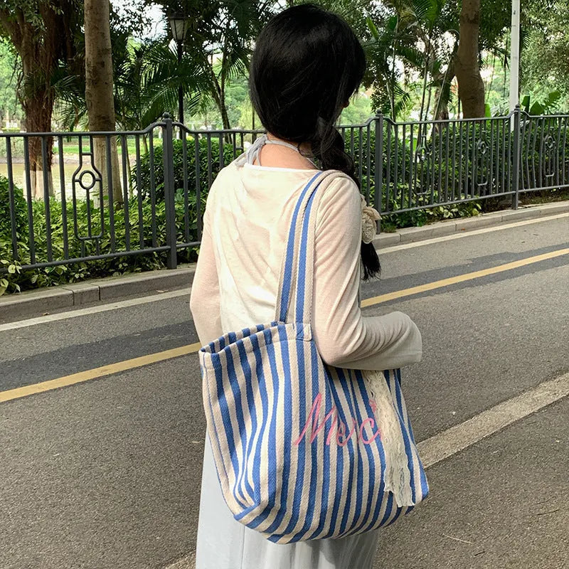 Blue and white striped cotton canvas bag with printed letter detailing for daily matching