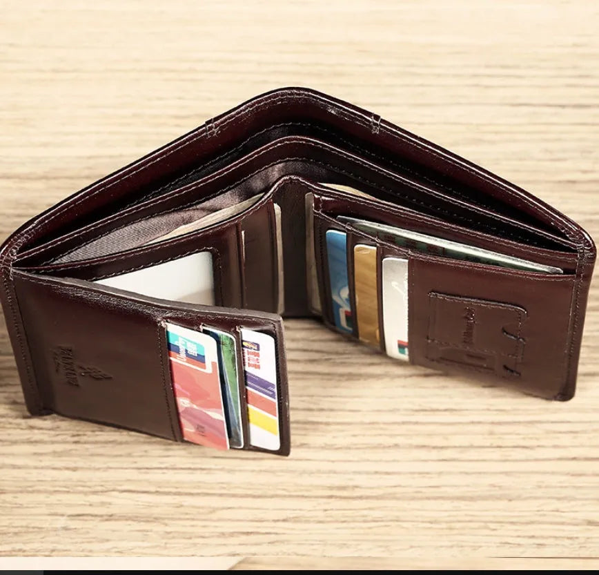 Men's black leather wallet open to show photo window, card slots, coin pocket and banknote folder.