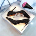 Women's silver crystal bridal shoe with a stiletto heel on a white background.