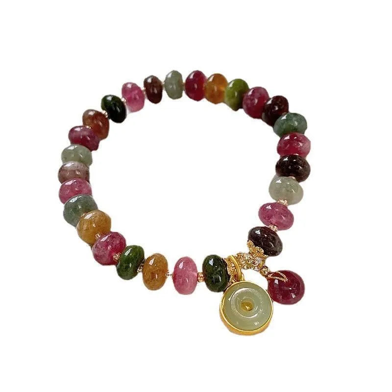 Handmade colourful tourmaline abacus bracelet with rabbit pendant charm on wrist