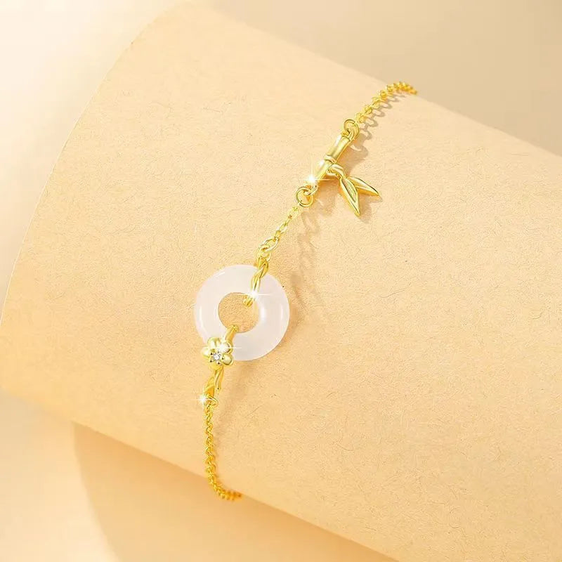 Women's silver bracelet with white chalcedony peace buckle charm and starry sky design