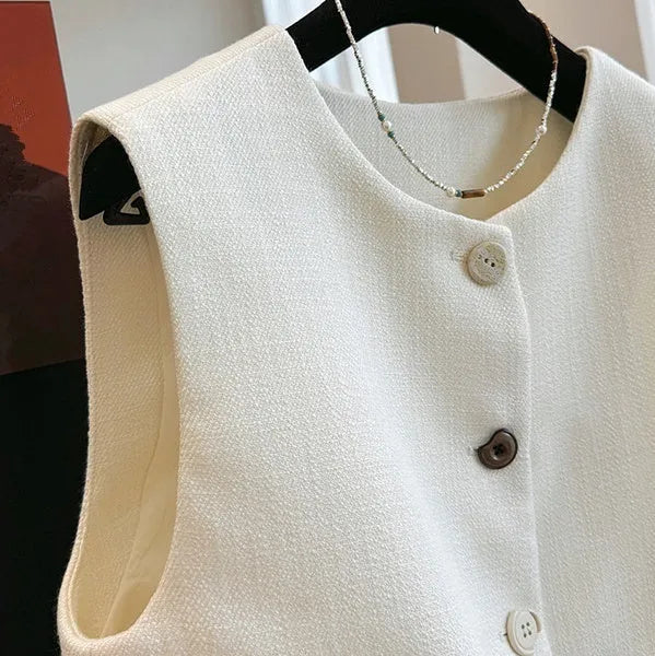 Women's round neck sleeveless vest in a fitted bandage dress style, shown in milky white.