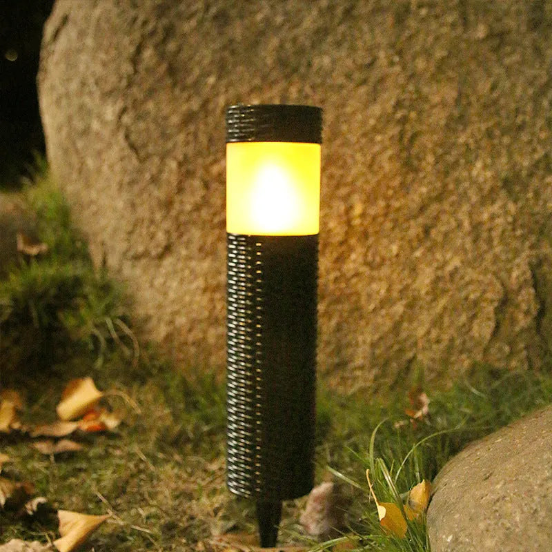 Outdoor garden light with abstract design and simulated flame effect for courtyard installation