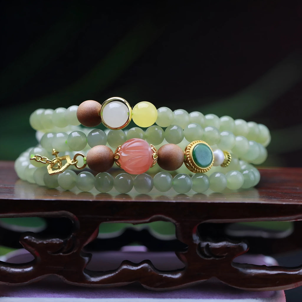 Hetian jade lotus bead necklace and bracelet set with white sandalwood and beeswax accents.