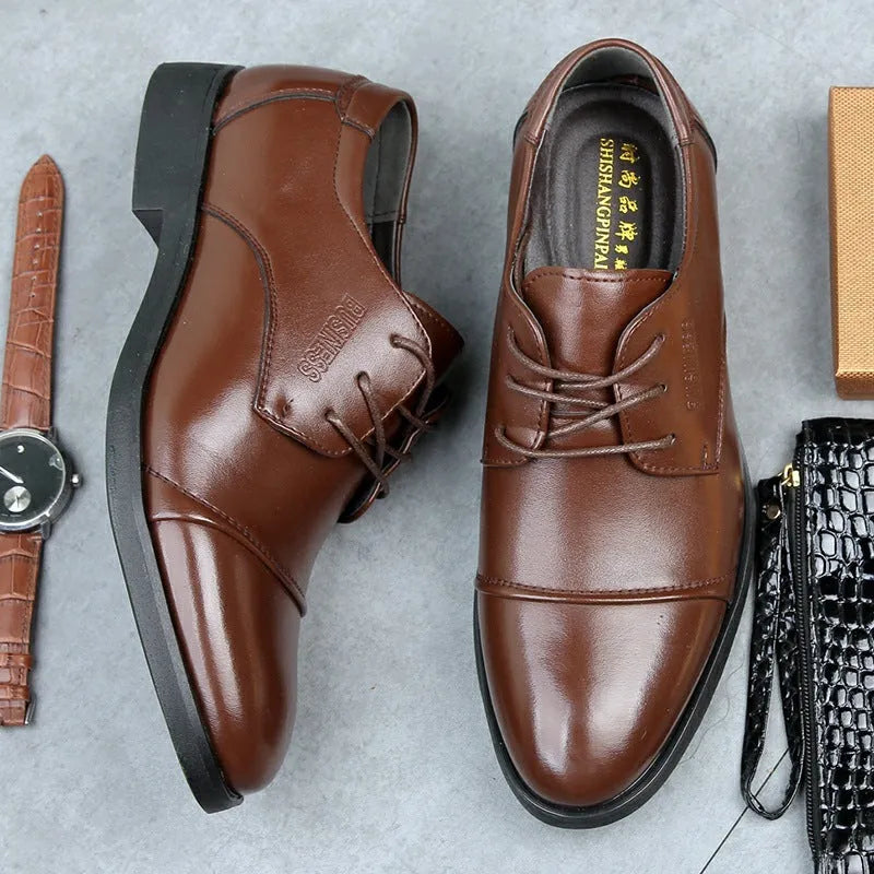 Men's black formal lace-up shoes with stitching detail on a rubber sole