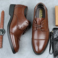 Men's black formal lace-up shoes with stitching detail on a rubber sole