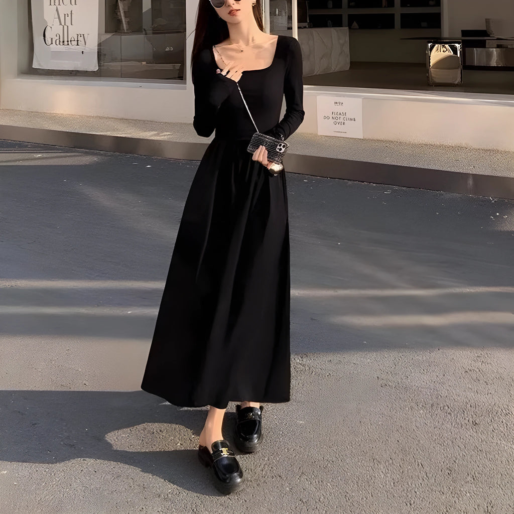 Black square collar long sleeve knitted dress with elastic waist and A-line skirt.