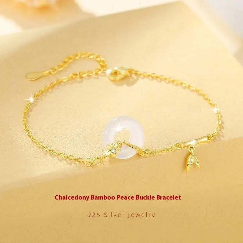 Women's silver bracelet with white chalcedony peace buckle charm and starry sky design