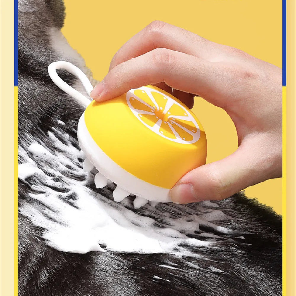 Yellow silicone pet bath brush with comb and massage functions for dog and cat grooming during washing