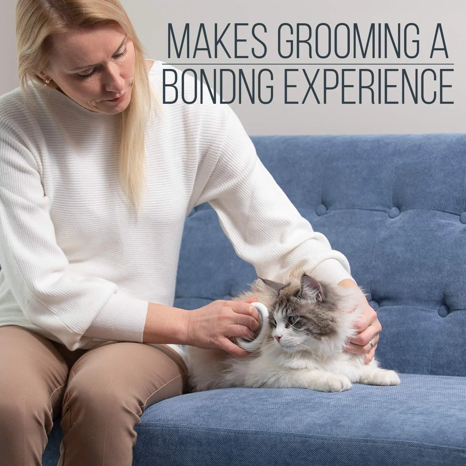 Blue pet grooming comb with soft teeth and an ergonomic plastic handle on a white background.