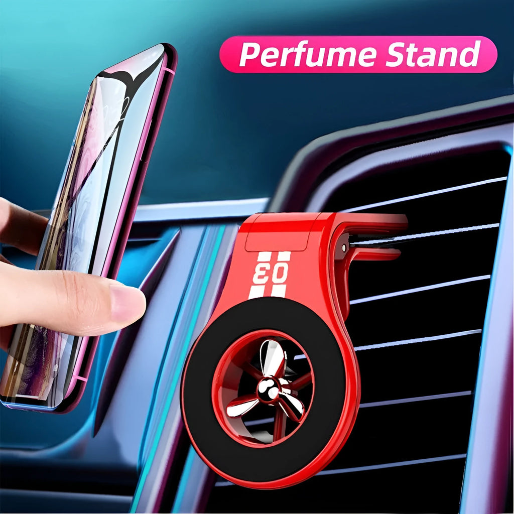 Black magnetic car air vent phone holder with adjustable ball joint and fragrance disc attached.