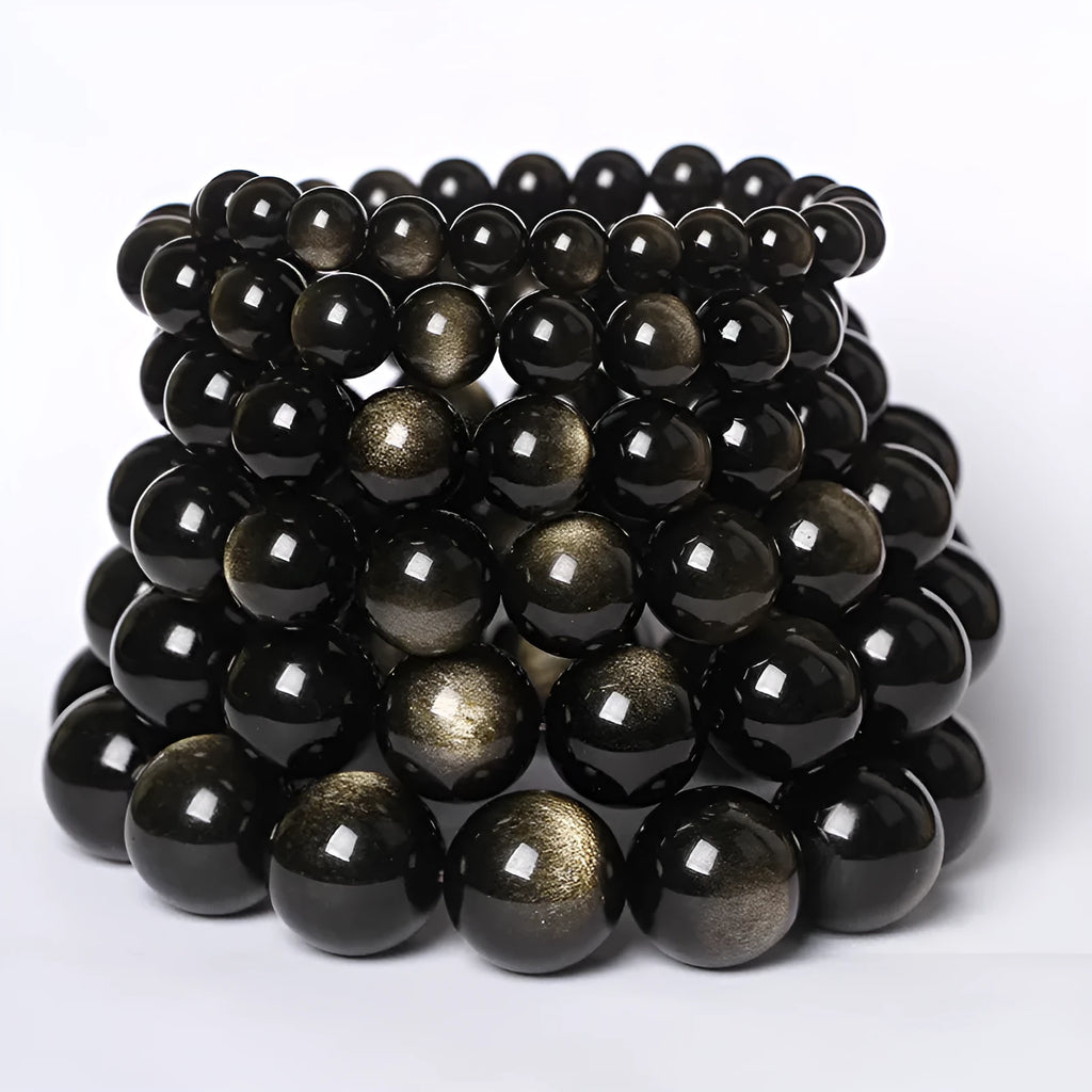 Hand-woven obsidian couple bracelets in various colours including black, silver, and rainbow eye obsidian