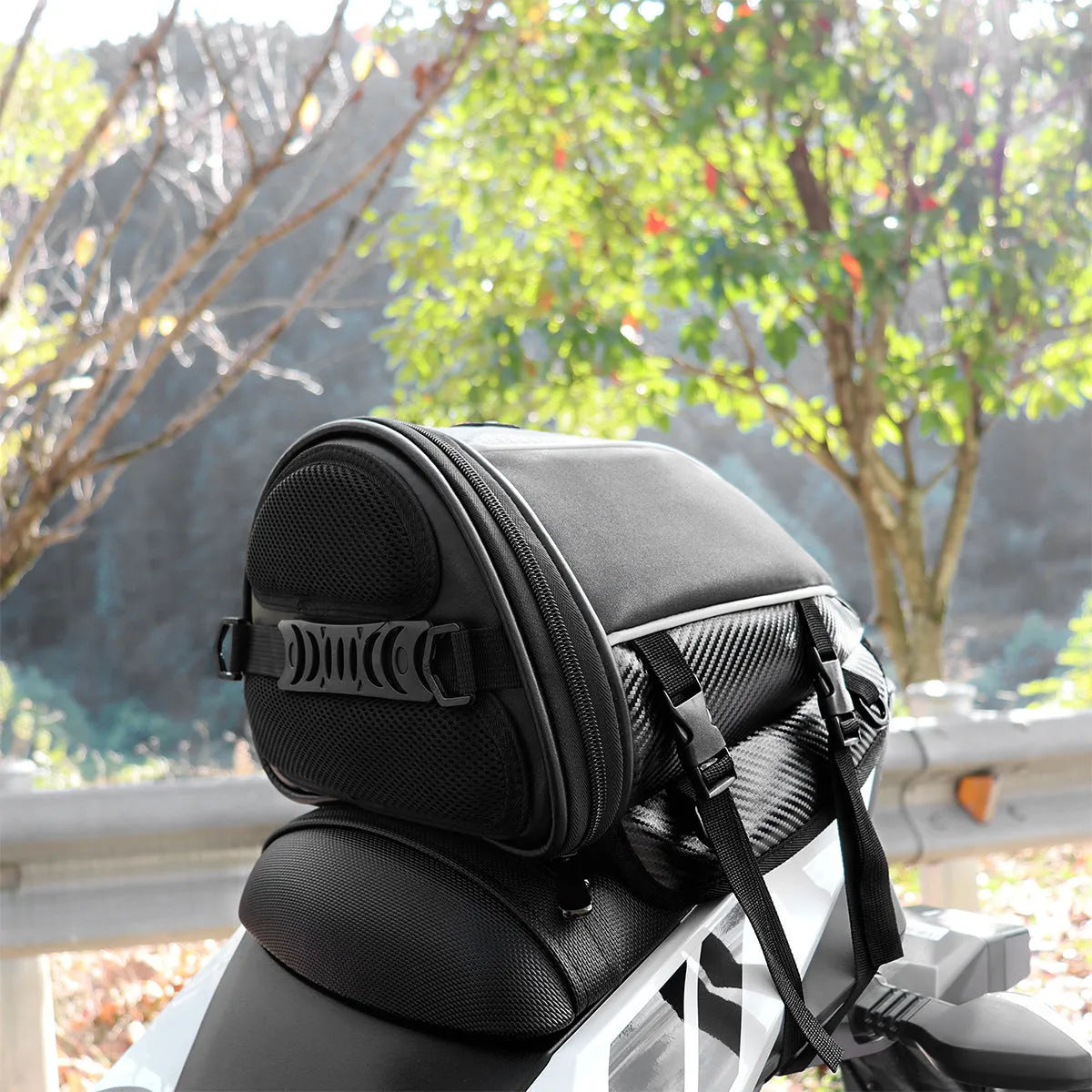 Black waterproof motorcycle seat bag with reflective strips, measuring 30x28x21cm with convertible crossbody strap