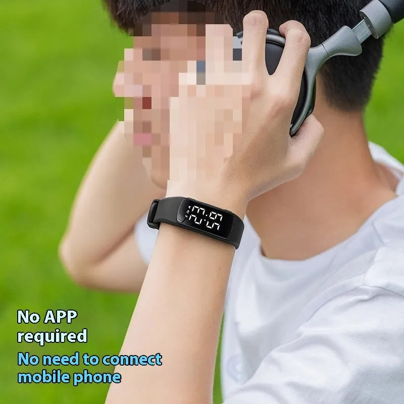Vibration alarm smart watch with coloured silicone strap and LED display on a wrist.