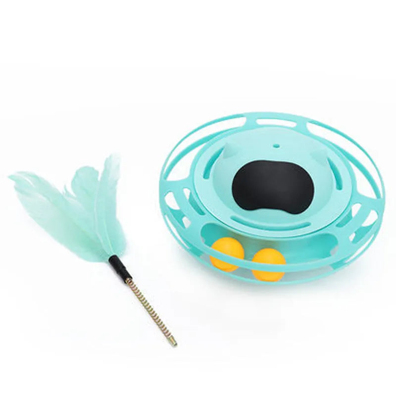 Pink cat tumbler turntable toy with interactive play stick on a flat surface.