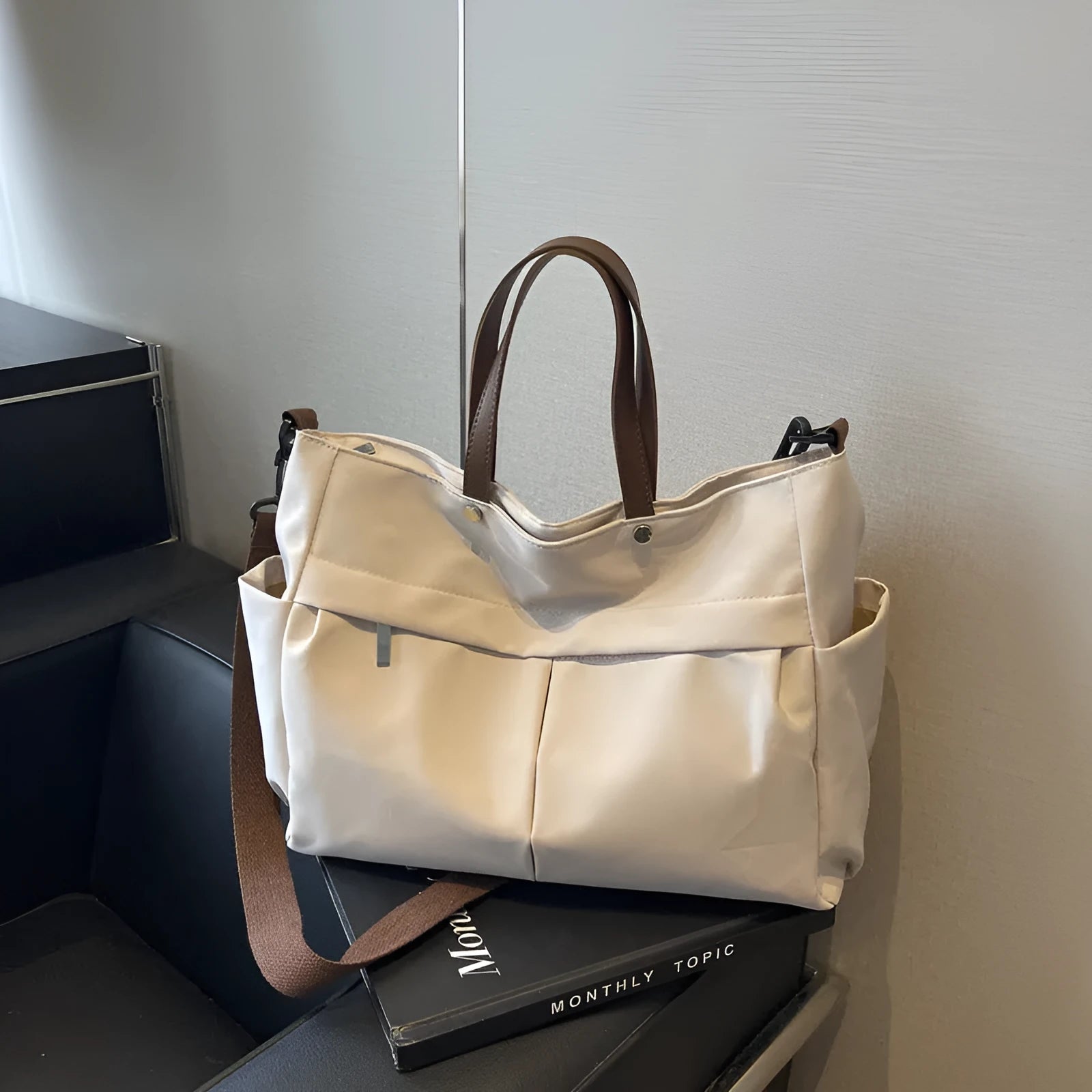 Nylon crossbody tote bag for women in black, shown with crossbody strap.