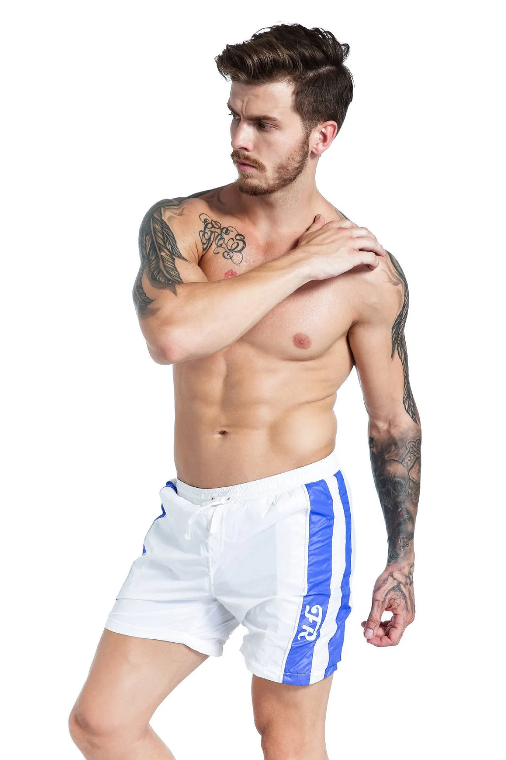 Man wearing blue slim-fit sports shorts with a lace-up front and padding.