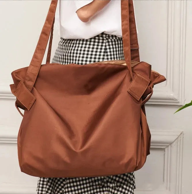 Women's waterproof Oxford cloth shoulder bag in black or light brown for travel camping and daily urban use
