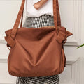 Women's waterproof Oxford cloth shoulder bag in black or light brown for travel camping and daily urban use